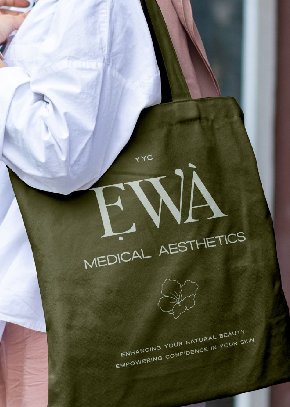 Green tote bag with medical aesthetics branding.