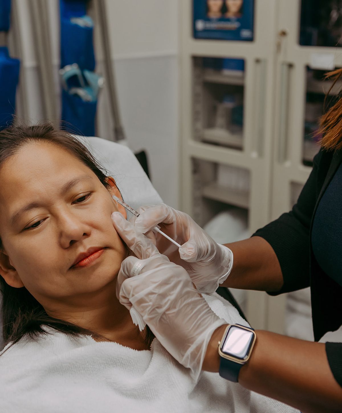 Patient receiving cosmetic treatment in medical setting.